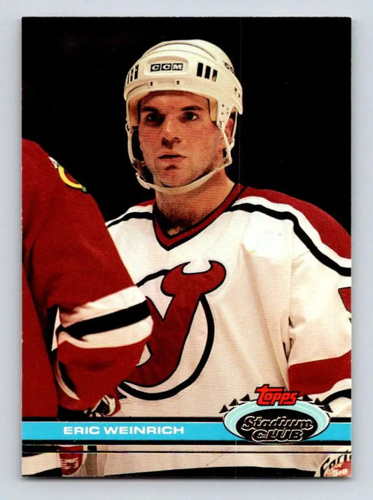 Hockey player in New Jersey Devils jersey representing Eric Weinrich on a hockey card