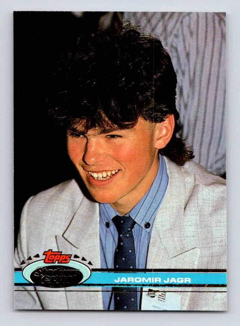 Vintage Topps Stadium Club hockey trading card of Jaromir Jagr in a gray suit and blue tie