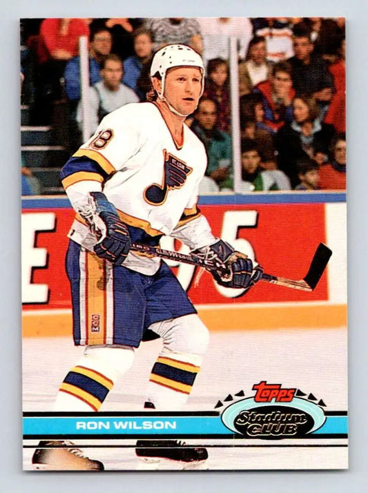 Hockey player in white and blue St. Louis Blues jersey from Ron Wilson hockey card