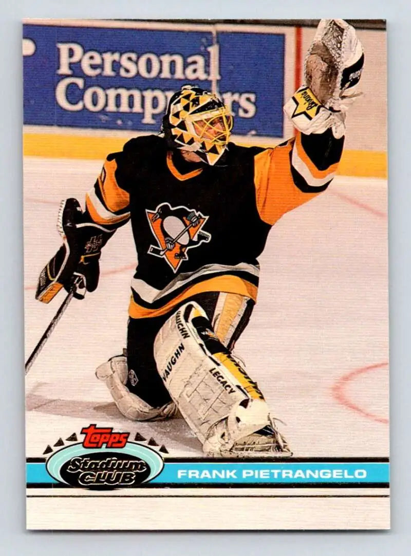 Frank Pietrangelo in black and gold uniform making a glove save for Pittsburgh Penguins