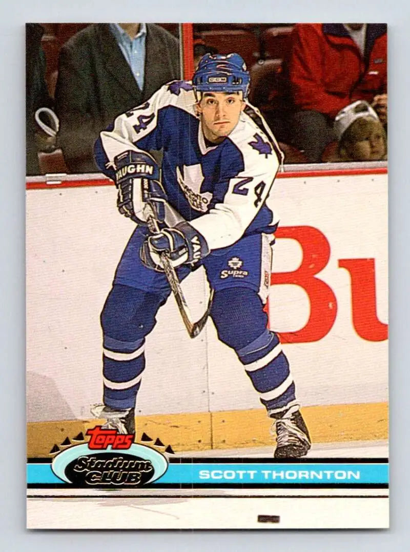 Hockey player in Toronto Maple Leafs uniform skating with a stick on hockey card