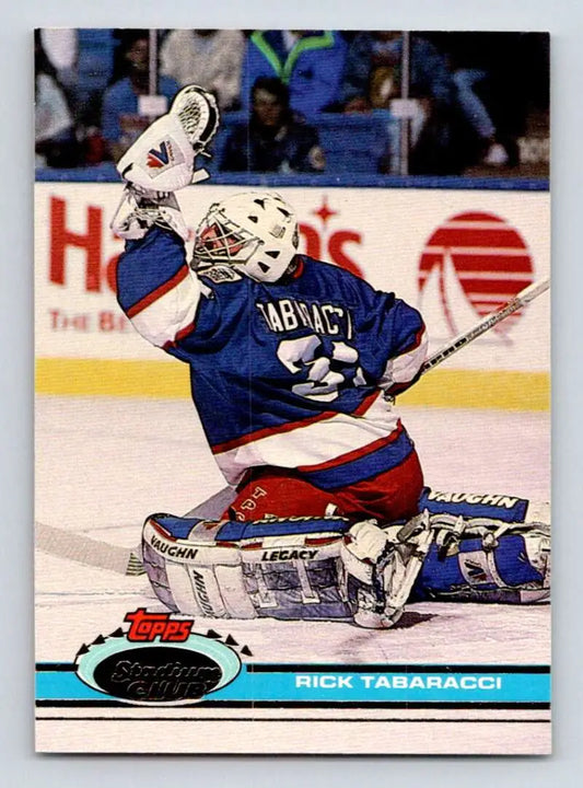 Hockey goalie Rick Tabaracci in New York Rangers uniform making a save on a card