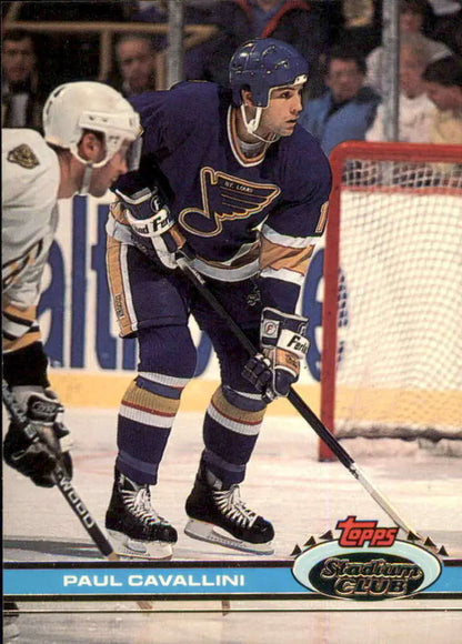 St. Louis Blues player skating with stick in Topps Stadium Club hockey card art