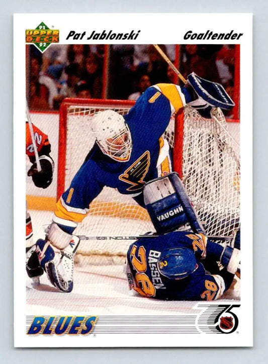 Hockey goalie in blue St. Louis Blues uniform making a save on Pat Jablonski card