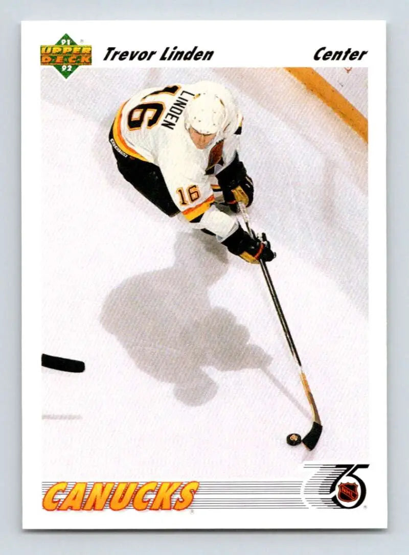 Hockey player in white Canucks jersey controlling puck for Trevor Linden Upper Deck card