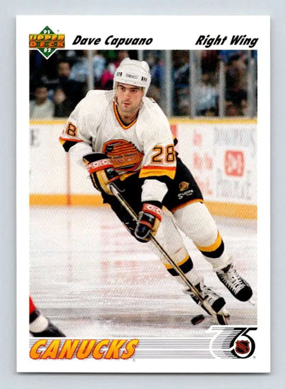 Hockey player in white Vancouver Canucks jersey skating, featured on 1991-92 Dave Capuano card