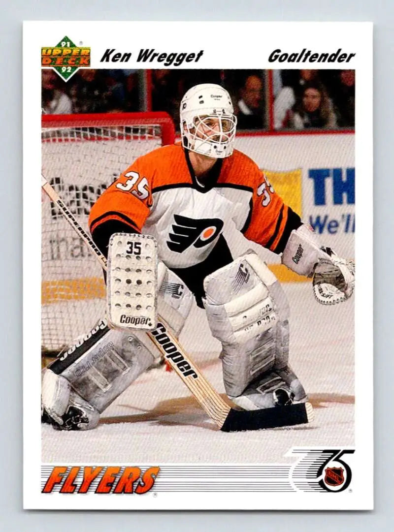 Ken Wregget in orange jersey ready as Philadelphia Flyers goalie on hockey card