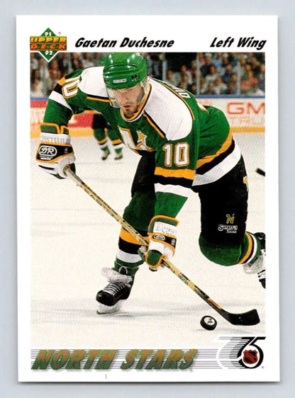 Hockey player in a North Stars jersey controlling the puck, Gaetan Duchesne card