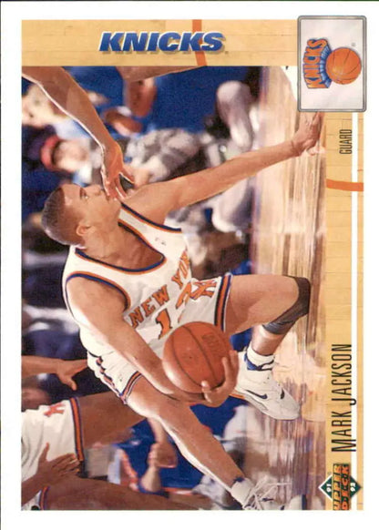 Basketball player in New York Knicks uniform falling with ball on Mark Jackson card