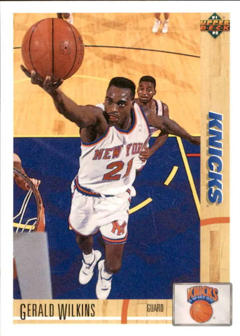 Gerald Wilkins New York Knicks basketball card, player in white uniform reaching for ball