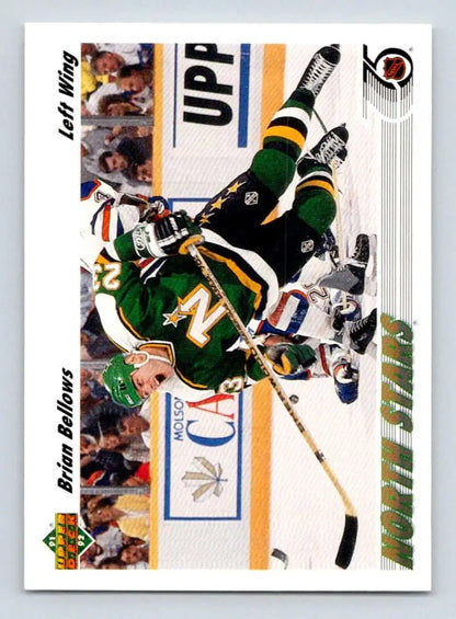 Hockey player in green Minnesota North Stars jersey falling on ice for Brian Bellows card