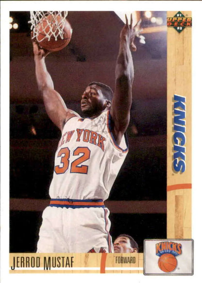 Basketball player in White New York Knicks Jersey #32 dunks - Jerrod Mustaf Basketball Card