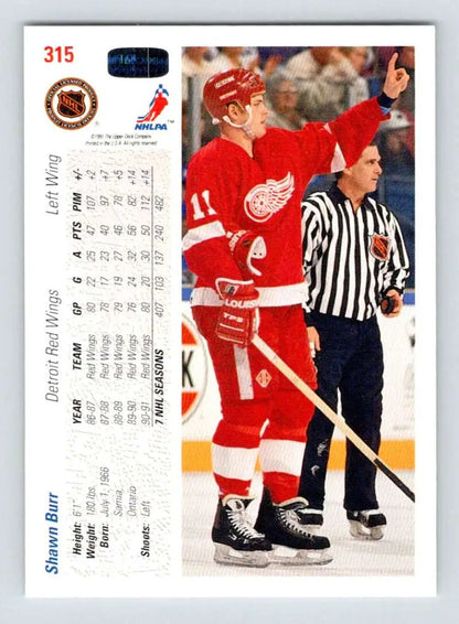 Hockey trading card of Shawn Burr from the Detroit Red Wings on ice with referee