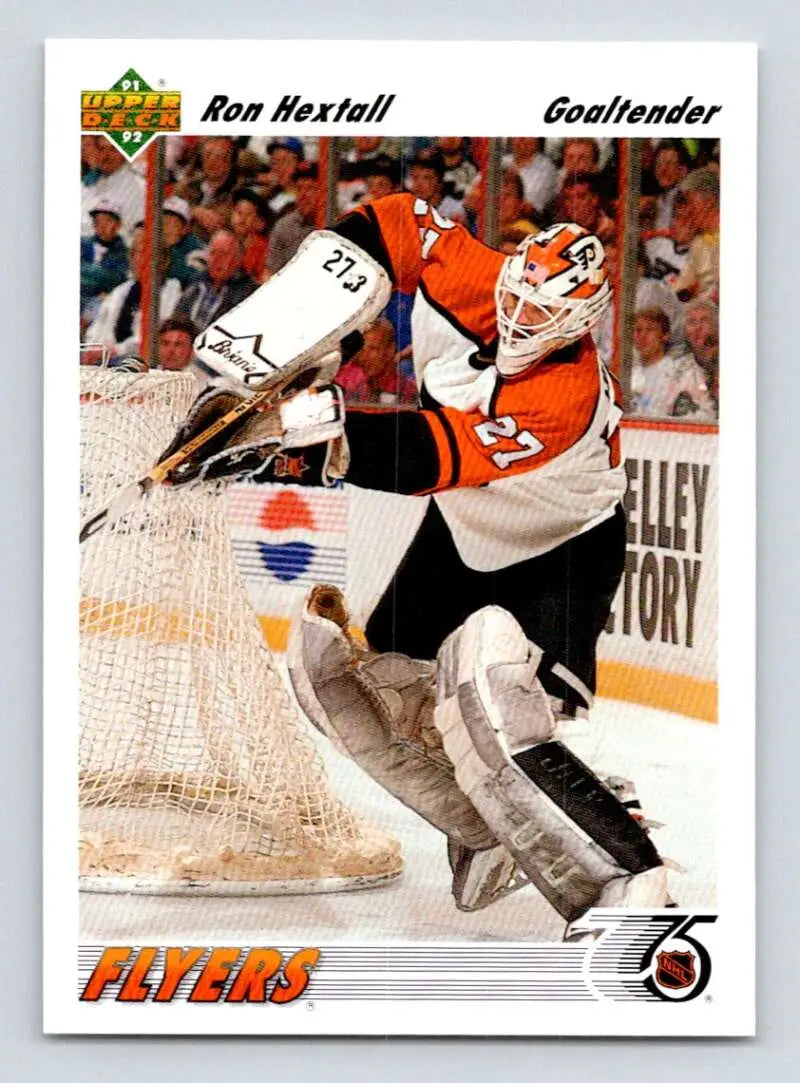 Ron Hextall in orange and black Philadelphia Flyers uniform making a save for Upper Deck card