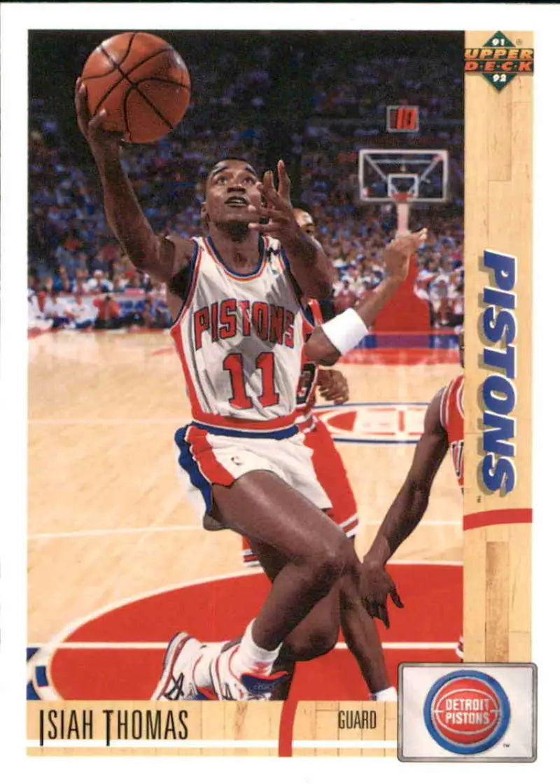 Basketball player in Detroit Pistons #11 jersey leaps for the basket on Isiah Thomas card