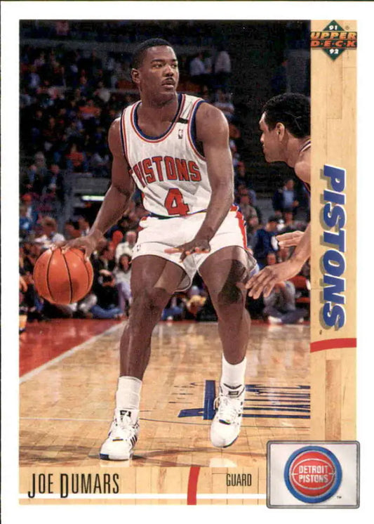 Joe Dumars dribbling in a white home uniform on 1991-92 Upper Deck Detroit Pistons card