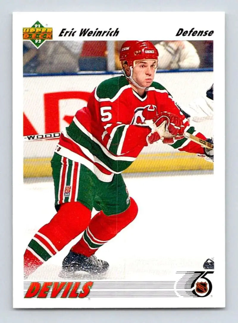 Hockey player in red and green Jersey Devils uniform on Eric Weinrich hockey card