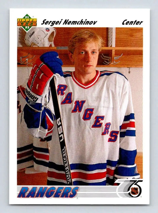 Hockey player in a white New York Rangers jersey highlighting Sergei Nemchinov Upper Deck card