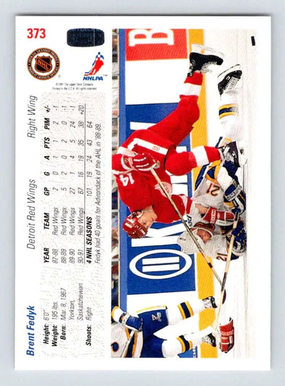 Hockey trading card featuring Detroit Red Wings players colliding during a game action