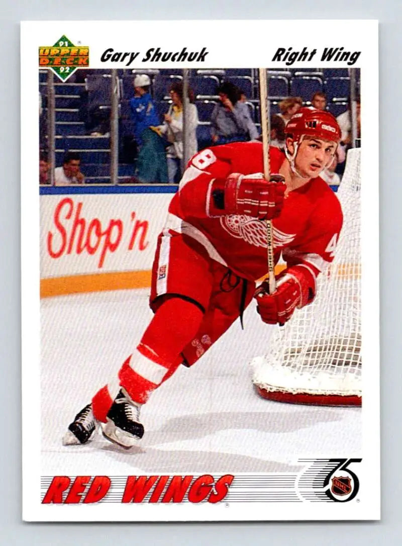 Detroit Red Wings player Gary Shuchuk skating in red jersey on ice rink