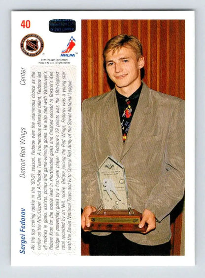 Hockey trading card of Sergei Fedorov, Detroit Red Wings, holding a trophy in a blazer