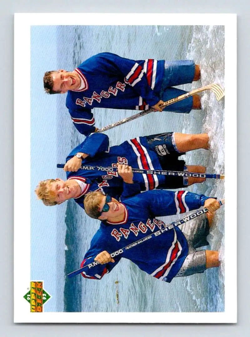 Three New York Rangers players in blue jerseys featured on 1991-92 Upper Deck rookie card