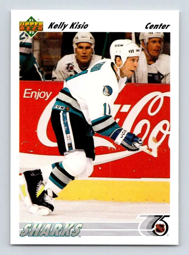 Hockey player in San Jose Sharks uniform skating past Coca-Cola ad, Kelly Kisio card image