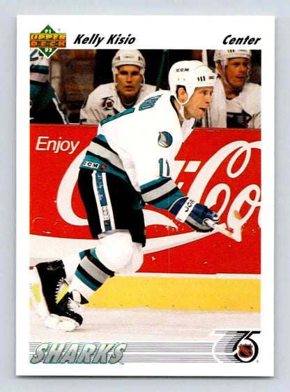 Hockey player in San Jose Sharks uniform skating past Coca-Cola ad, Kelly Kisio card image