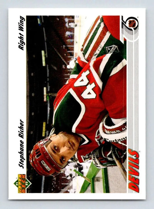 Hockey player in red Minnesota Wild jersey, featuring Stephane Richer on a hockey card