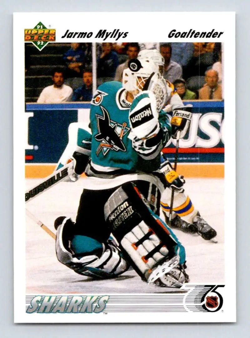 Hockey trading card of Jarmo Myllys making a save for the San Jose Sharks