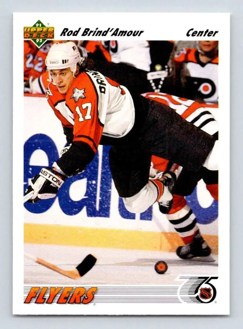 Hockey player in Philadelphia Flyers uniform skating with puck on Upper Deck card