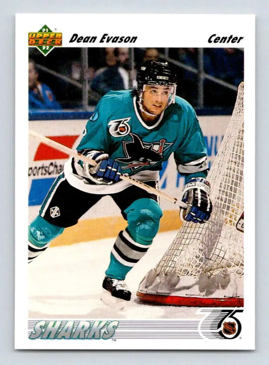 Hockey player in teal San Jose Sharks jersey skating near goal, Upper Deck card featuring Dean Evason