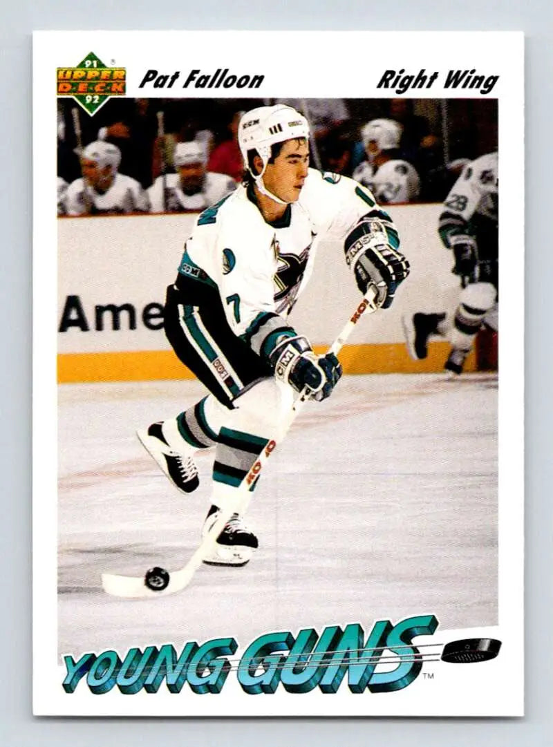 Hockey player in teal San Jose Sharks uniform skating on ice, featuring Pat Falloon