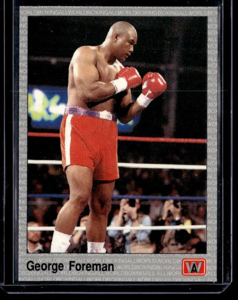 Boxer in red shorts and gloves in fighting stance on George Foreman NM-MT boxing card