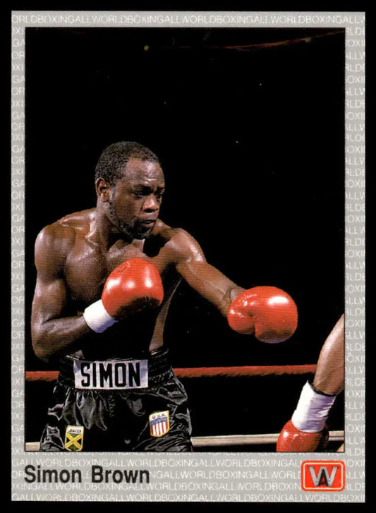 Boxer Simon Brown in black shorts and red gloves on 1991 All World Boxing Card