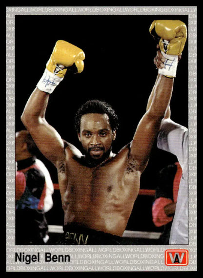 Victorious Nigel Benn raises yellow gloves after a match, featured on boxing card