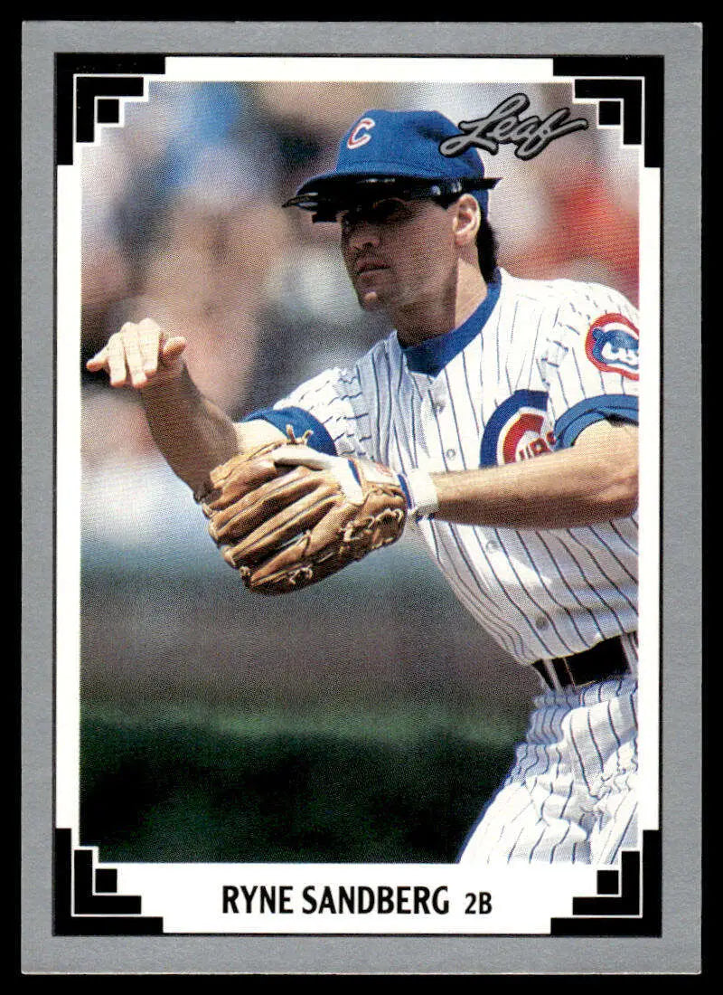 Ryne Sandberg baseball card showing Chicago Cubs player in white pinstripes making throw