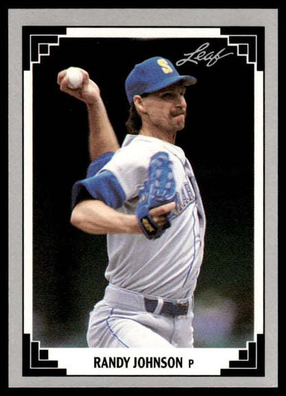 Baseball card of Randy Johnson pitching in Seattle Mariners uniform mid-throwing motion