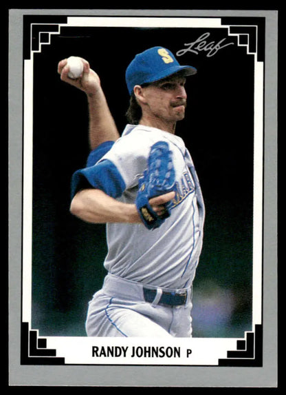 Baseball card of Randy Johnson mid-throw in Seattle Mariners uniform with blue accents