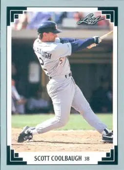 Scott Coolbaugh swinging a bat in a white uniform for the San Diego Padres Baseball Card