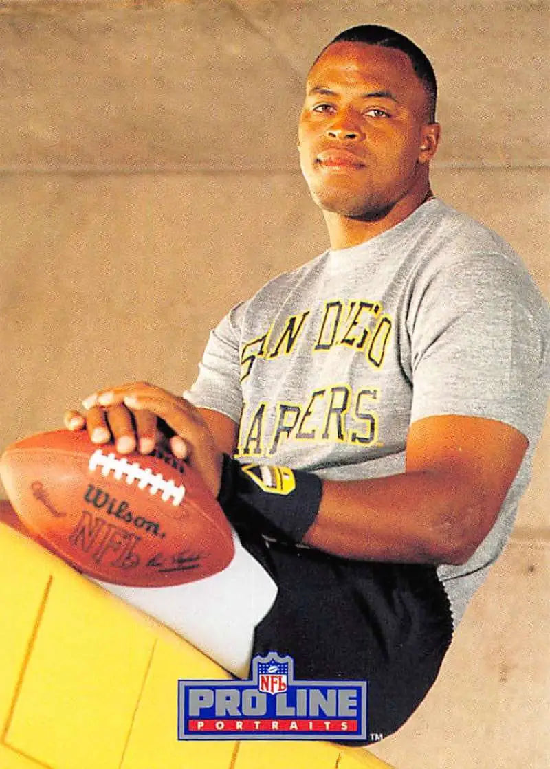 Rod Bernstine in a San Diego Chargers t-shirt holding a football for Pro Line Portraits