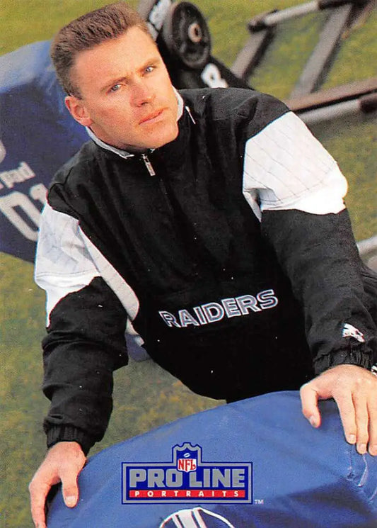 Person in black and white Raiders jacket, showcasing Los Angeles Raiders style