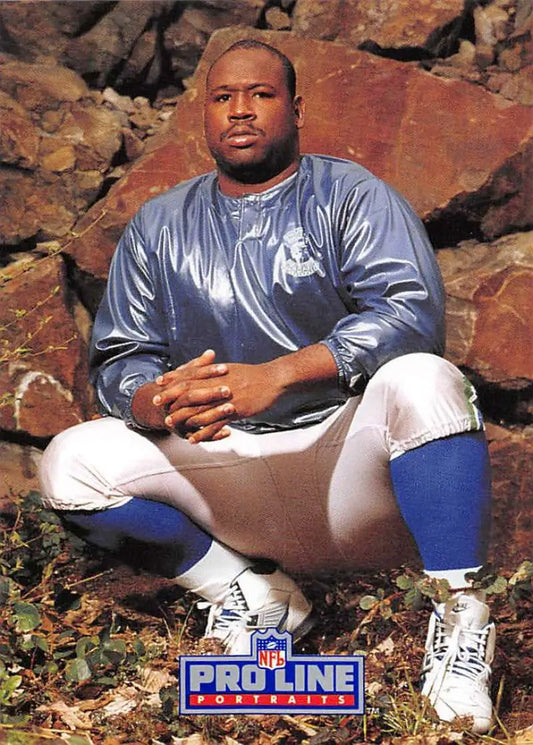 NFL player in Detroit Lions uniform on rocks for Cortez Kennedy Pro Line Portraits card