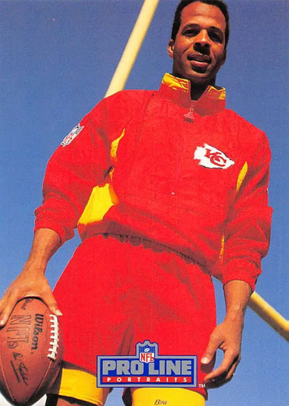 Stephone Paige in red Kansas City Chiefs uniform holding a football for 1991 card