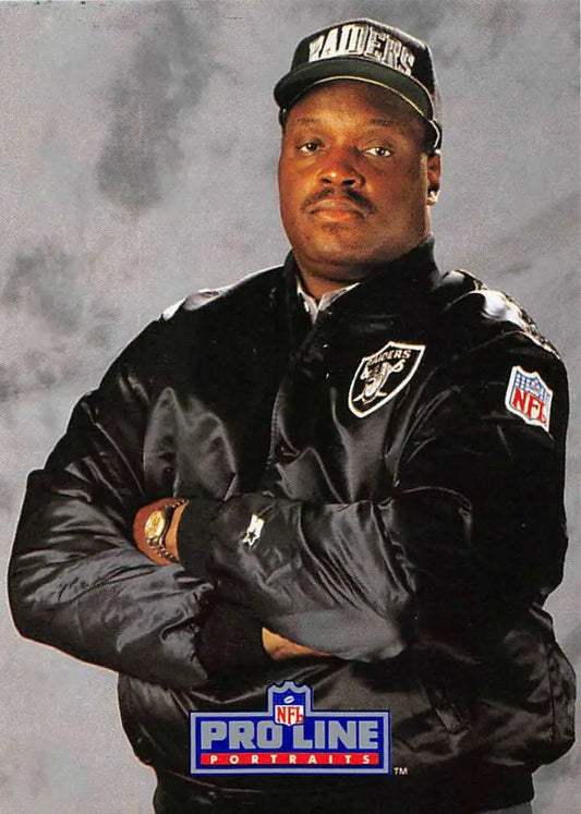 Art Shell coaching the Los Angeles Raiders in a black jacket and cap, arms crossed