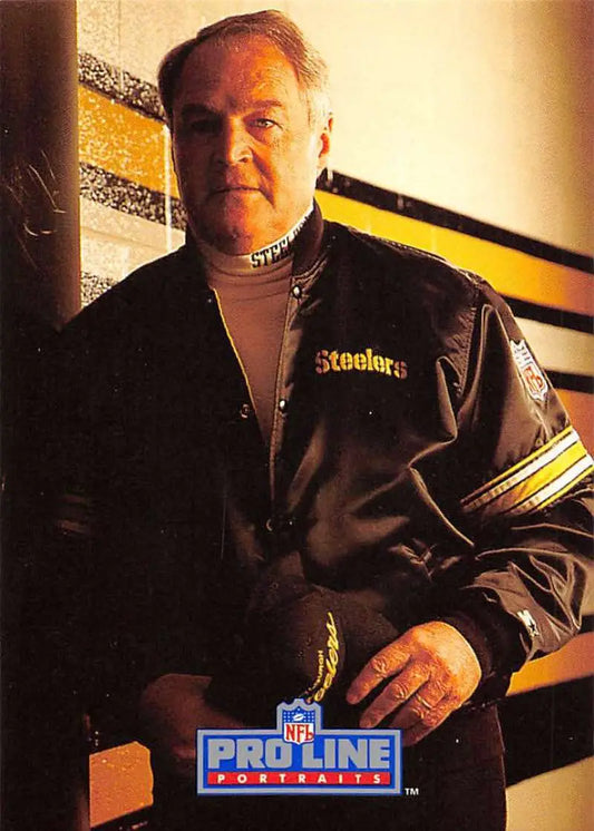 Person in Pittsburgh Steelers jacket and turtleneck, showcasing Chuck Noll Football Card