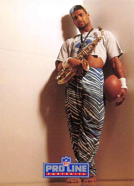 Eugene Robinson playing basketball in zebra-striped pants holding a saxophone