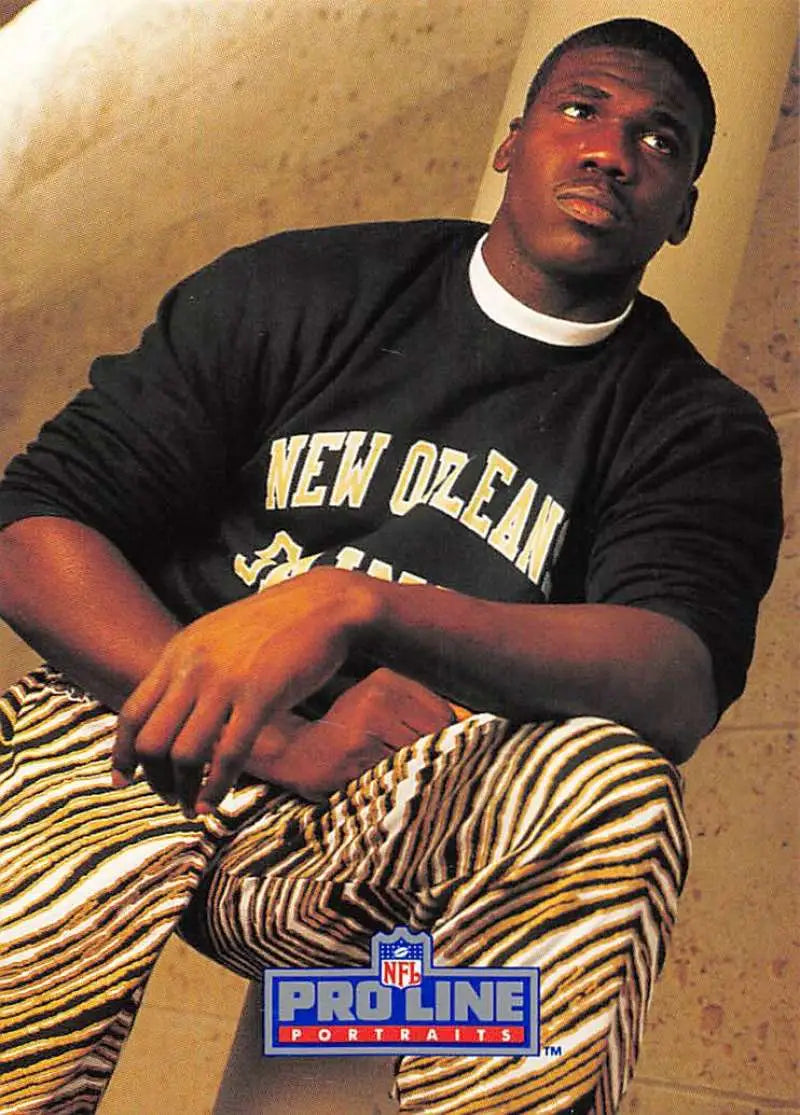 Person in New Orleans sweatshirt and zebra-striped pants with Renaldo Turnbull card