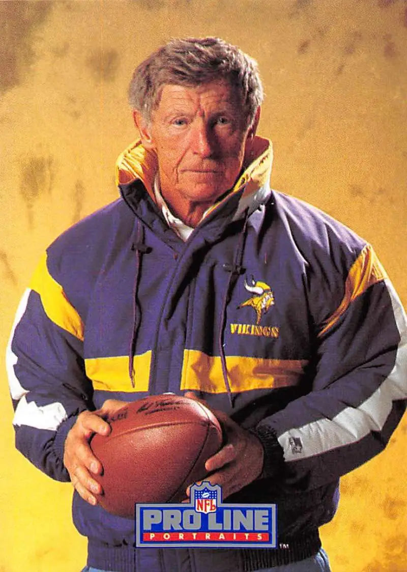 Jerry Burns in a Minnesota Vikings jacket holding a football for the football card