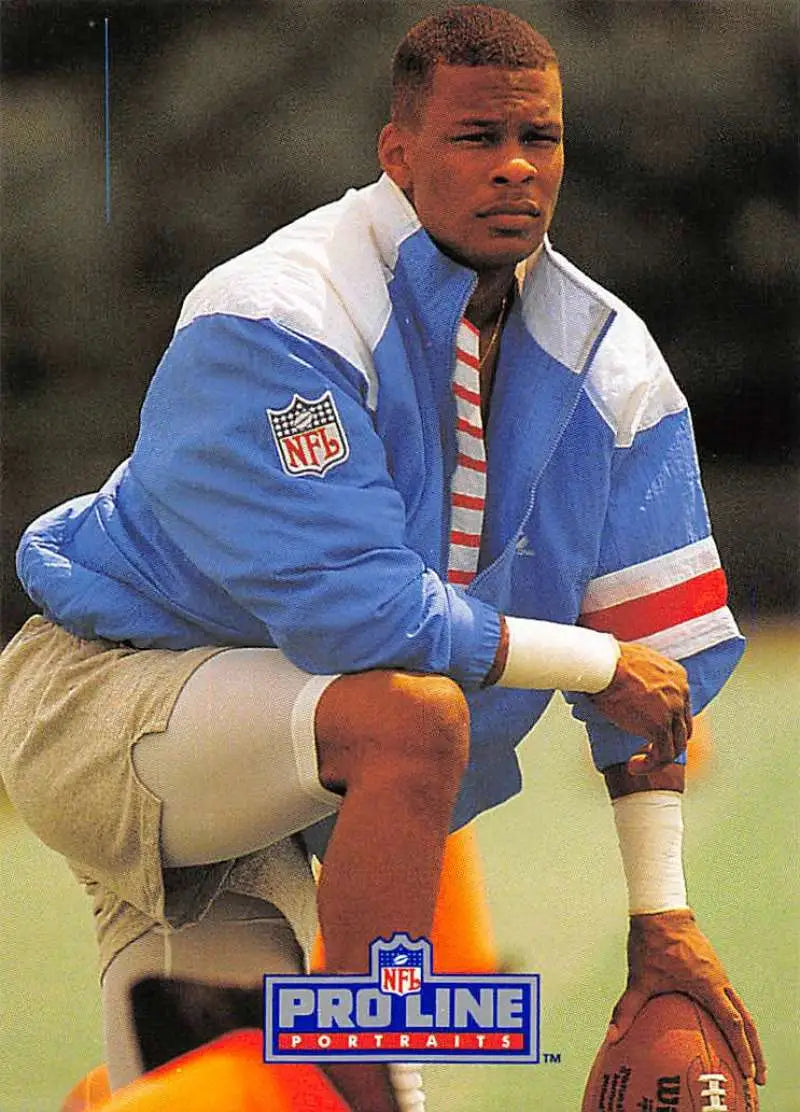 NFL Pro Line jacket in blue, white, and red with khaki shorts featuring Mike Dumas